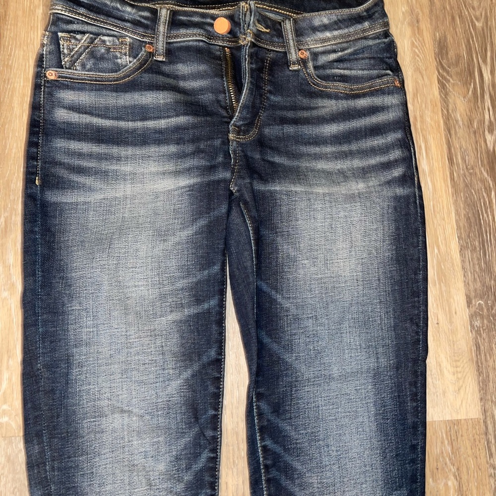 Buckle black skinny jeans